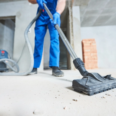 Crew performing final post-construction cleaning in a finished commercial space