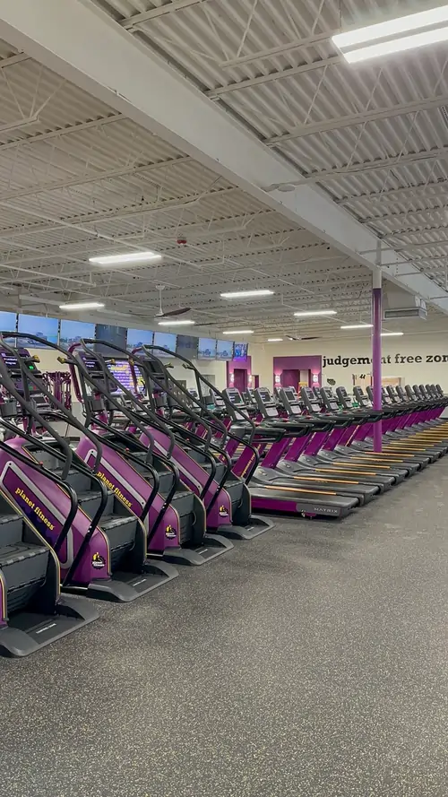 Row of spotless treadmills in a freshly cleaned fitness center