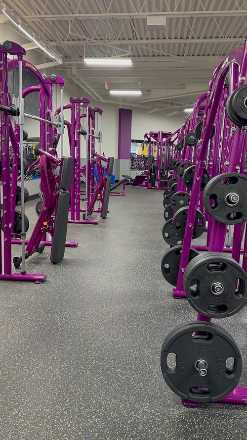 Cleaned and disinfected strength equipment on a gym floor