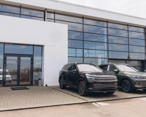 Clean dealership building exterior and lot affecting cleaning scope