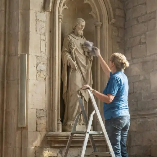 Professional carefully cleaning wooden pews and altar surfaces