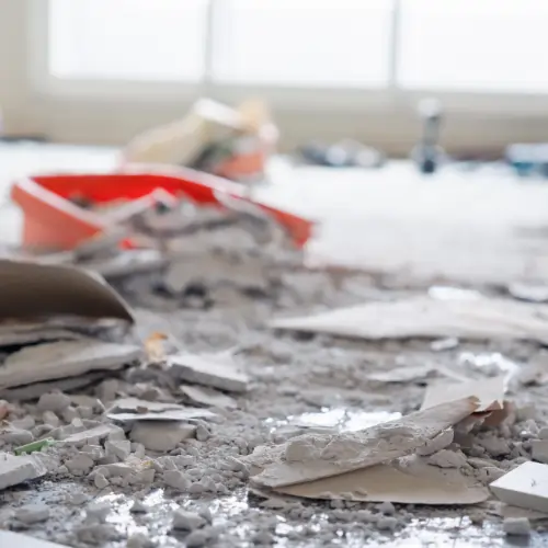 Leftover debris and fine dust covering a newly renovated interior