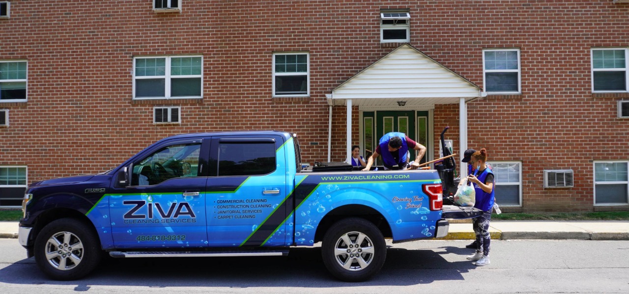 Ziva Cleaning Services team loading equipment into a company truck